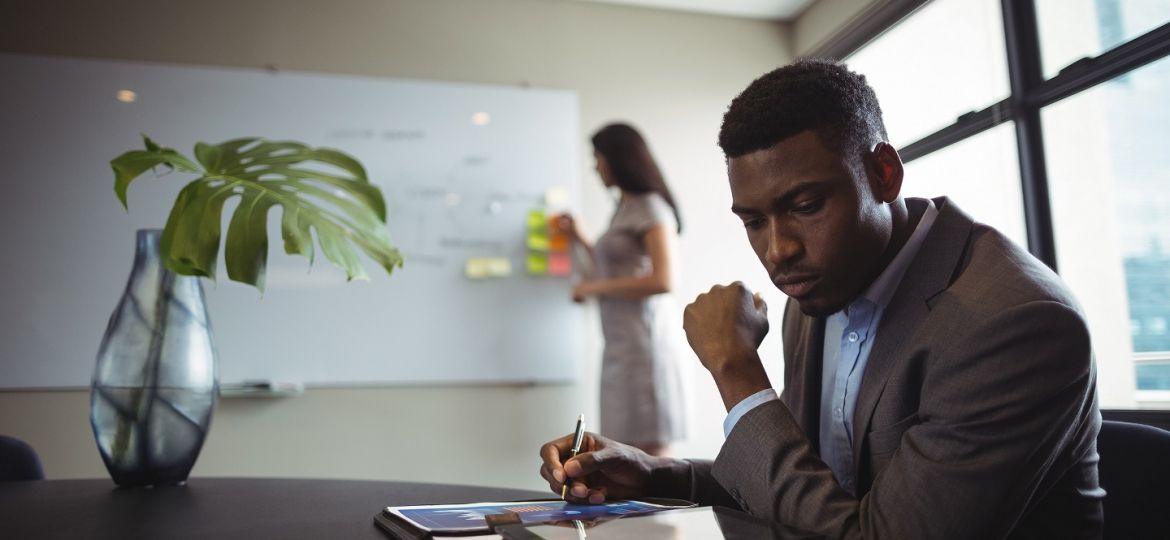 Businessman using digital tablet in office